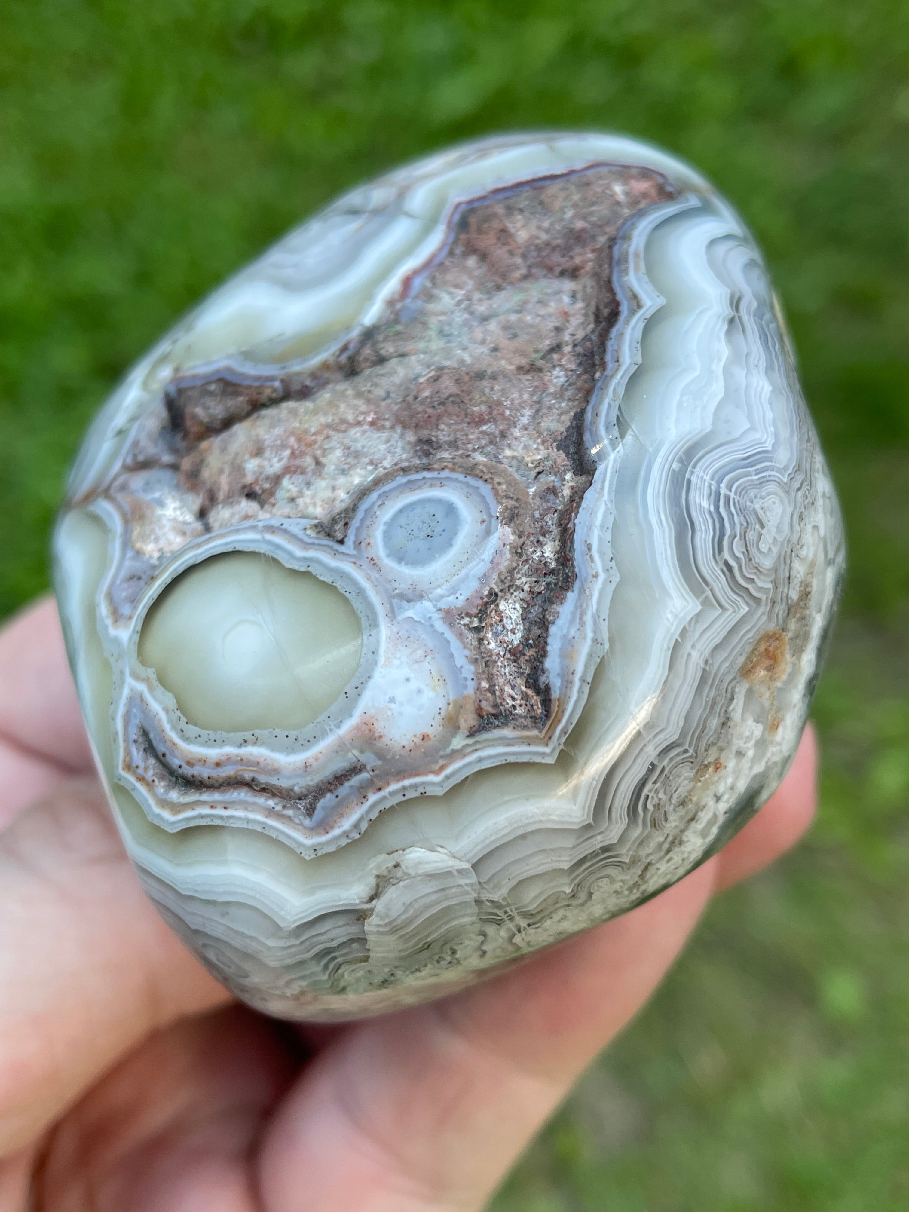 StoneBorn Creations Hand-Polished Lace Agate Freeform with Intricate Fortification Banding, Orbicular Eyes, Natural Matrix & Curved Display Face