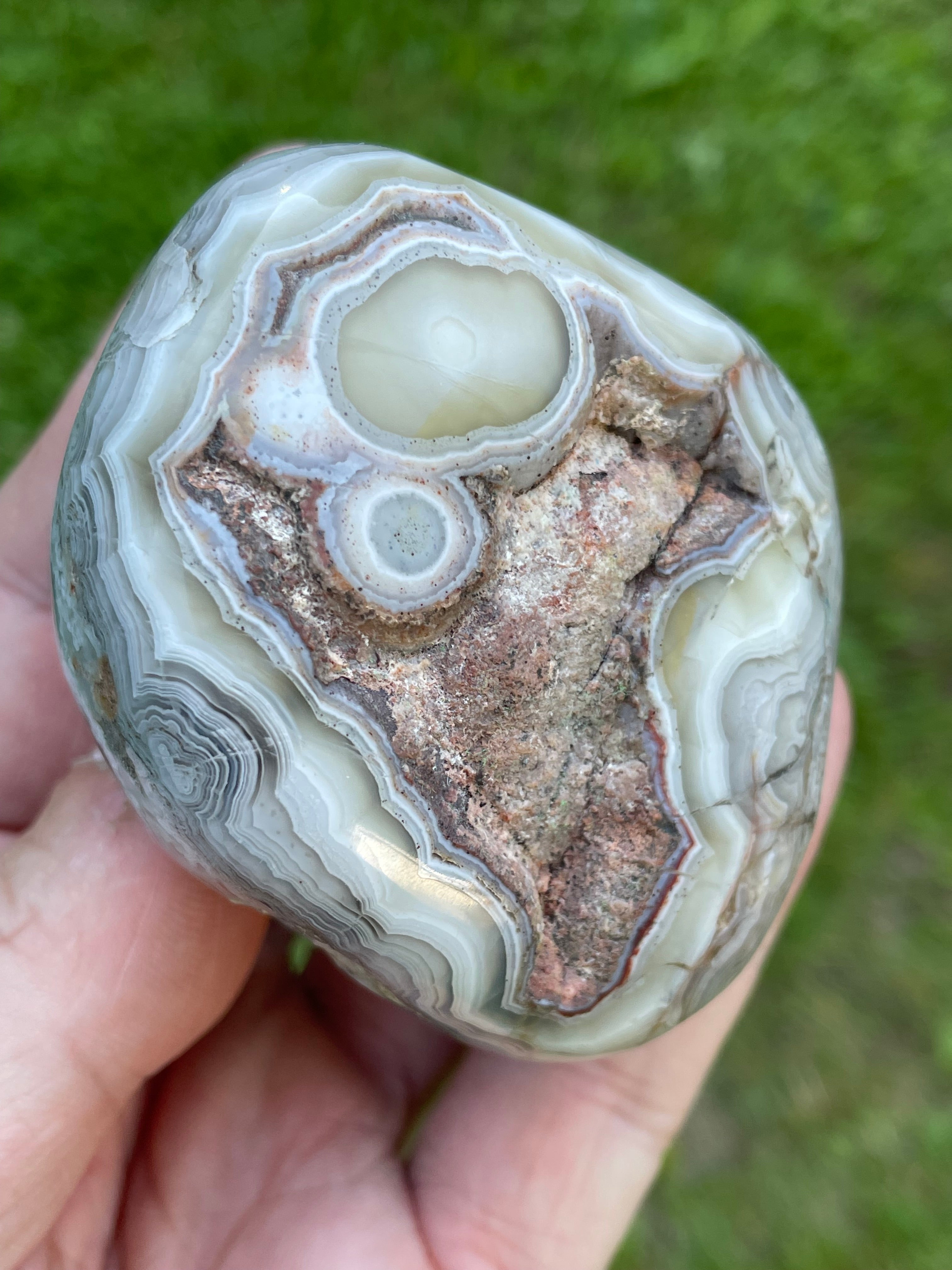 StoneBorn Creations Hand-Polished Lace Agate Freeform with Intricate Fortification Banding, Orbicular Eyes, Natural Matrix & Curved Display Face
