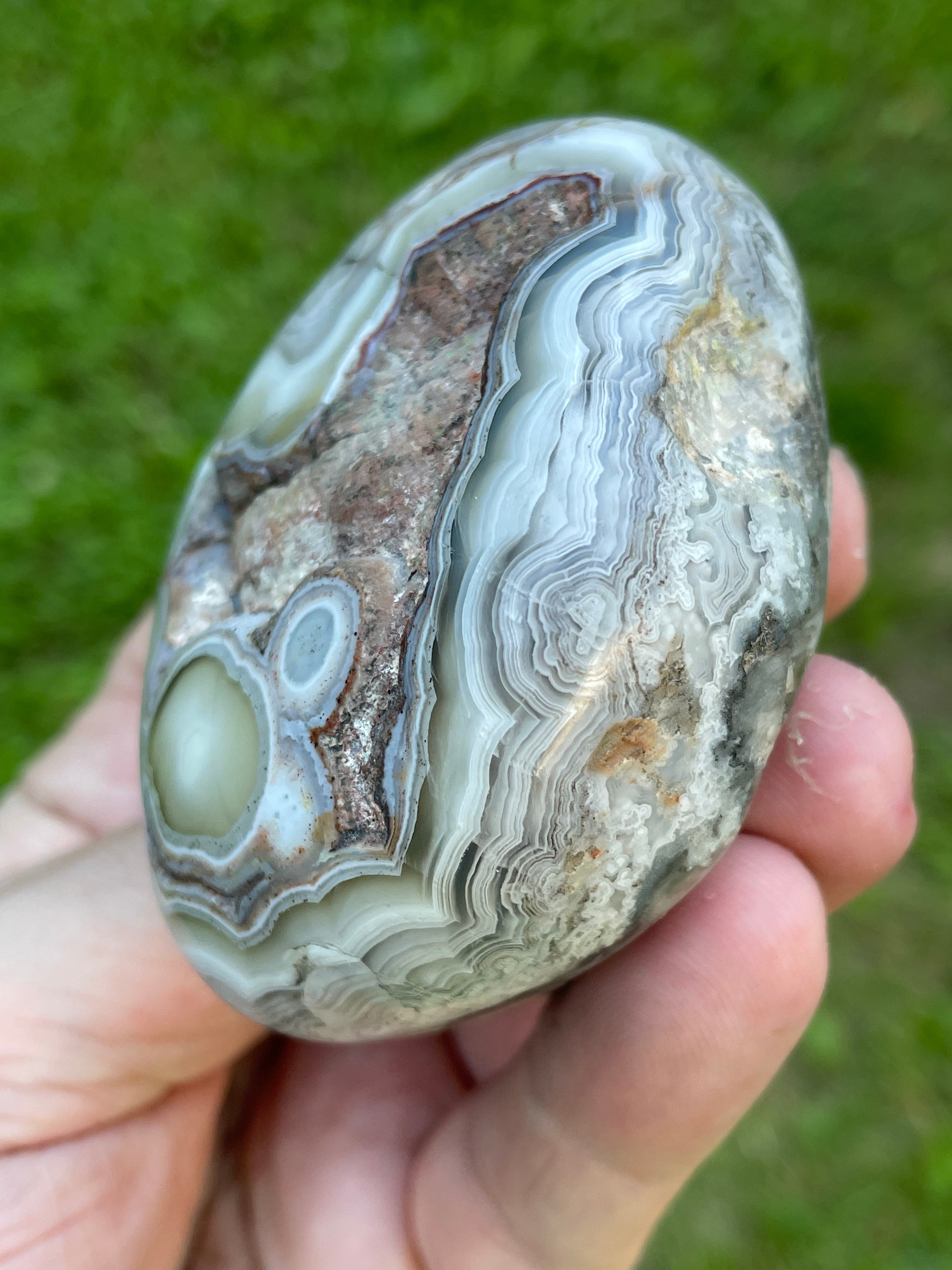 StoneBorn Creations Hand-Polished Lace Agate Freeform with Intricate Fortification Banding, Orbicular Eyes, Natural Matrix & Curved Display Face