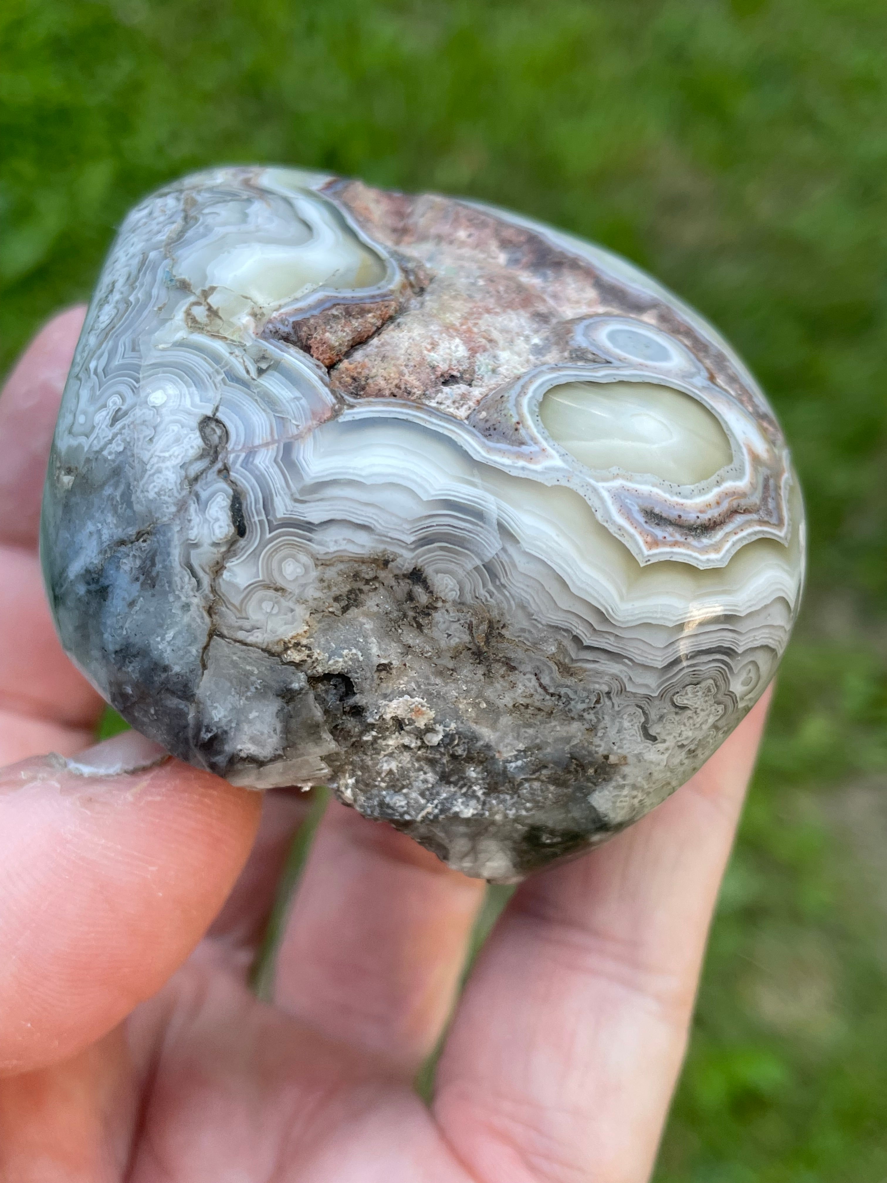 StoneBorn Creations Hand-Polished Lace Agate Freeform with Intricate Fortification Banding, Orbicular Eyes, Natural Matrix & Curved Display Face