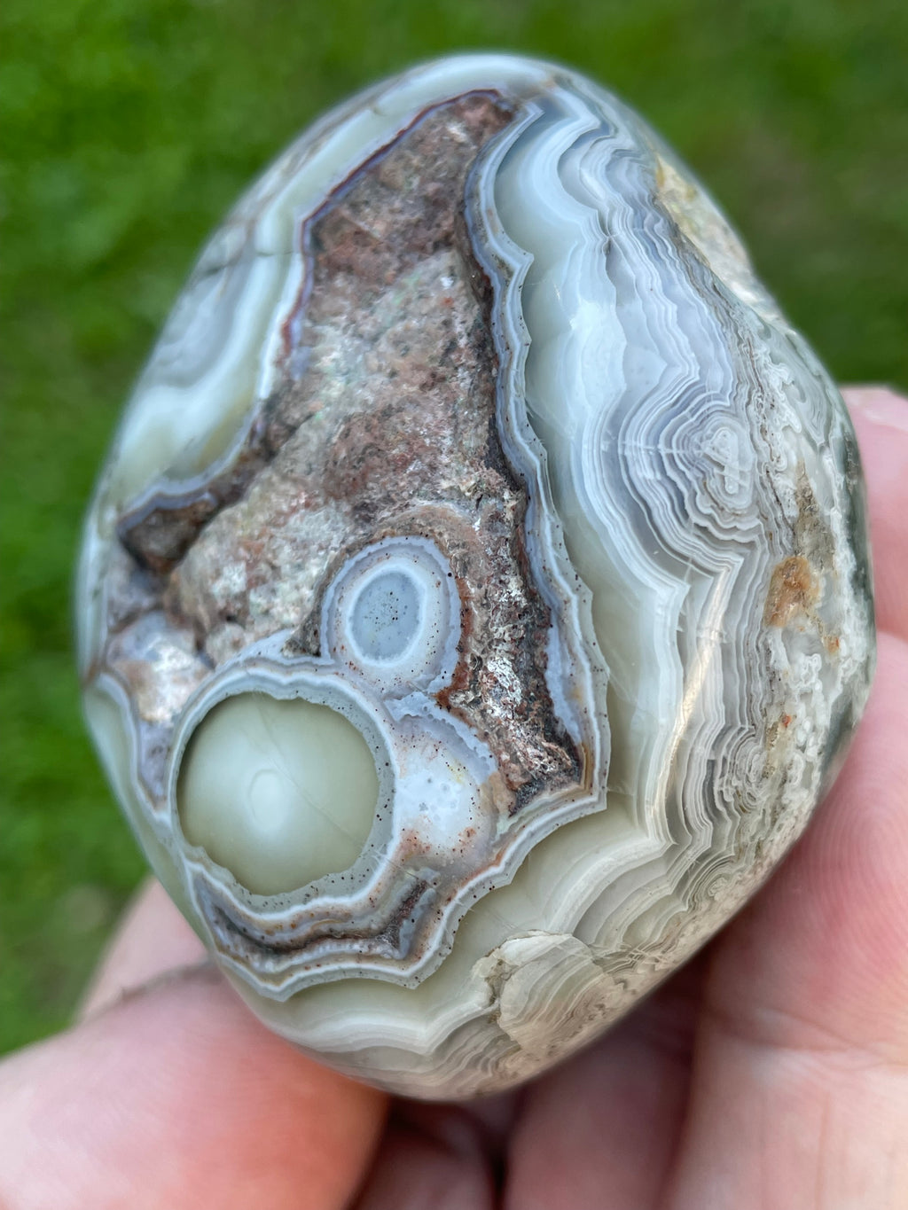 StoneBorn Creations Hand-Polished Lace Agate Freeform with Intricate Fortification Banding, Orbicular Eyes, Natural Matrix & Curved Display Face