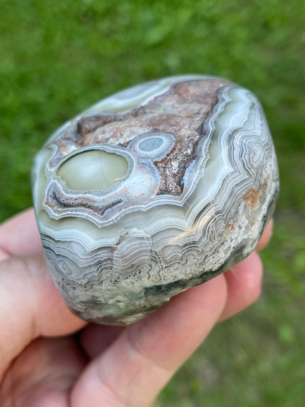 StoneBorn Creations Hand-Polished Lace Agate Freeform with Intricate Fortification Banding, Orbicular Eyes, Natural Matrix & Curved Display Face