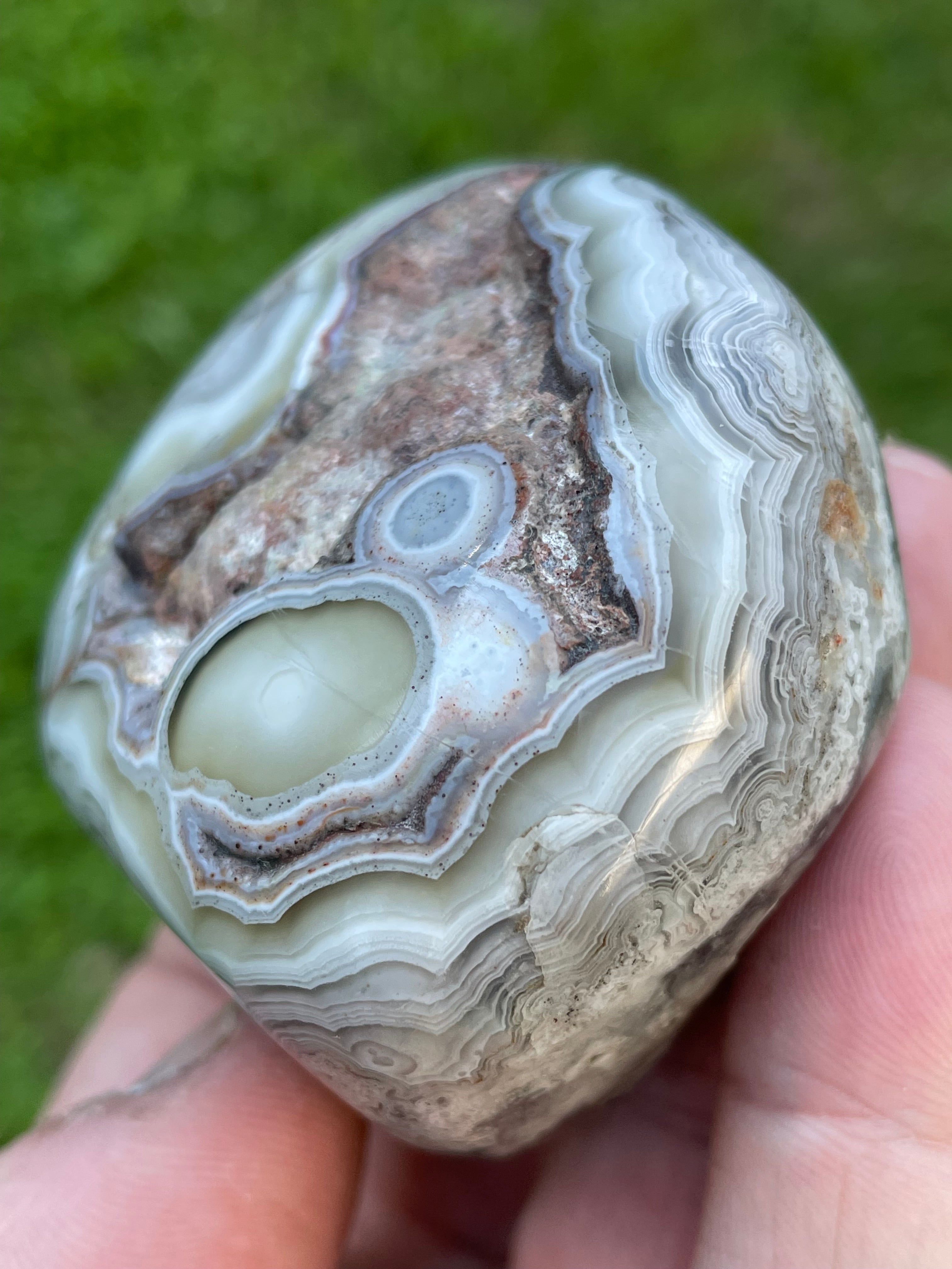 StoneBorn Creations Hand-Polished Lace Agate Freeform with Intricate Fortification Banding, Orbicular Eyes, Natural Matrix & Curved Display Face