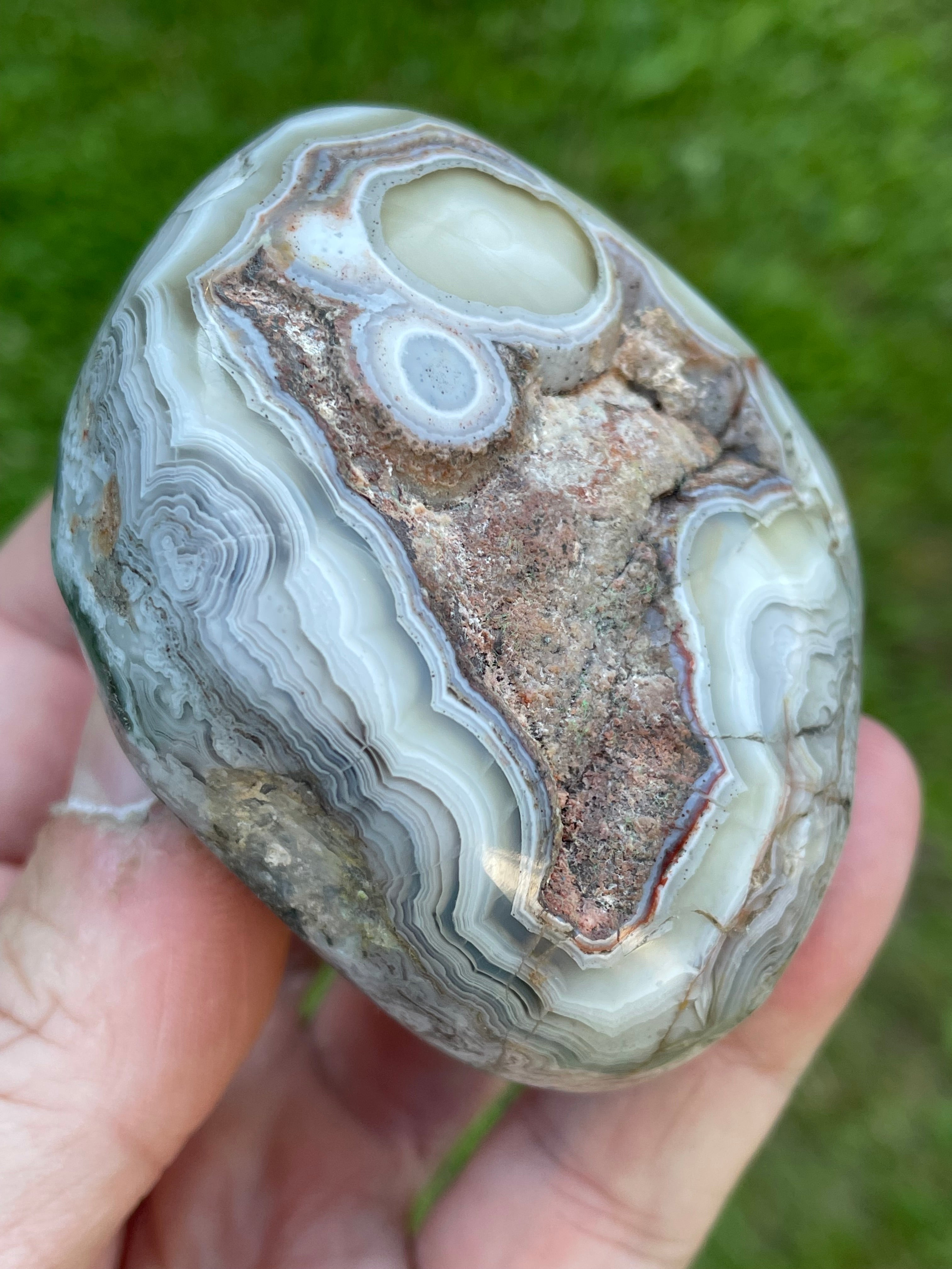 StoneBorn Creations Hand-Polished Lace Agate Freeform with Intricate Fortification Banding, Orbicular Eyes, Natural Matrix & Curved Display Face