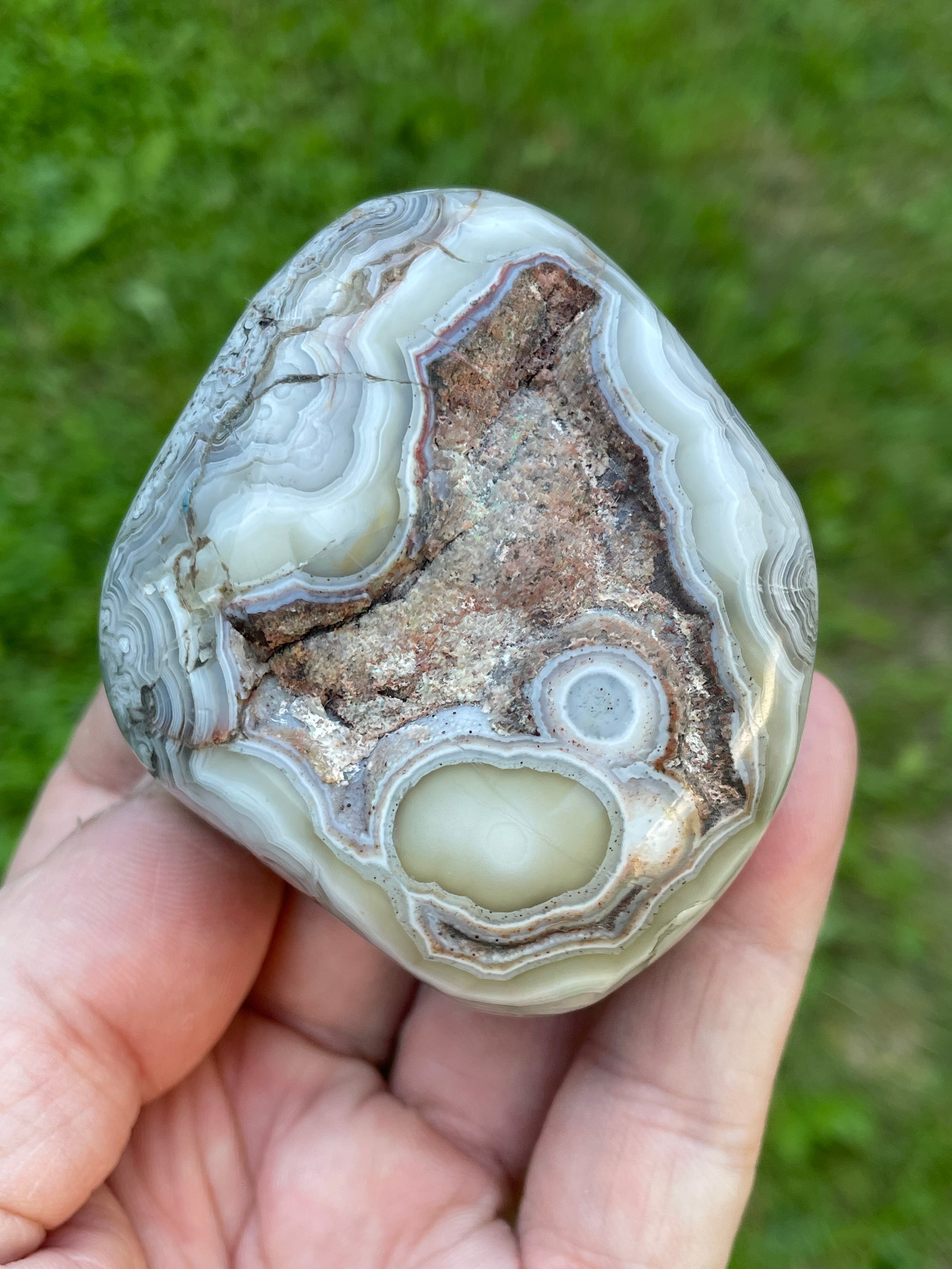 StoneBorn Creations Hand-Polished Lace Agate Freeform with Intricate Fortification Banding, Orbicular Eyes, Natural Matrix & Curved Display Face