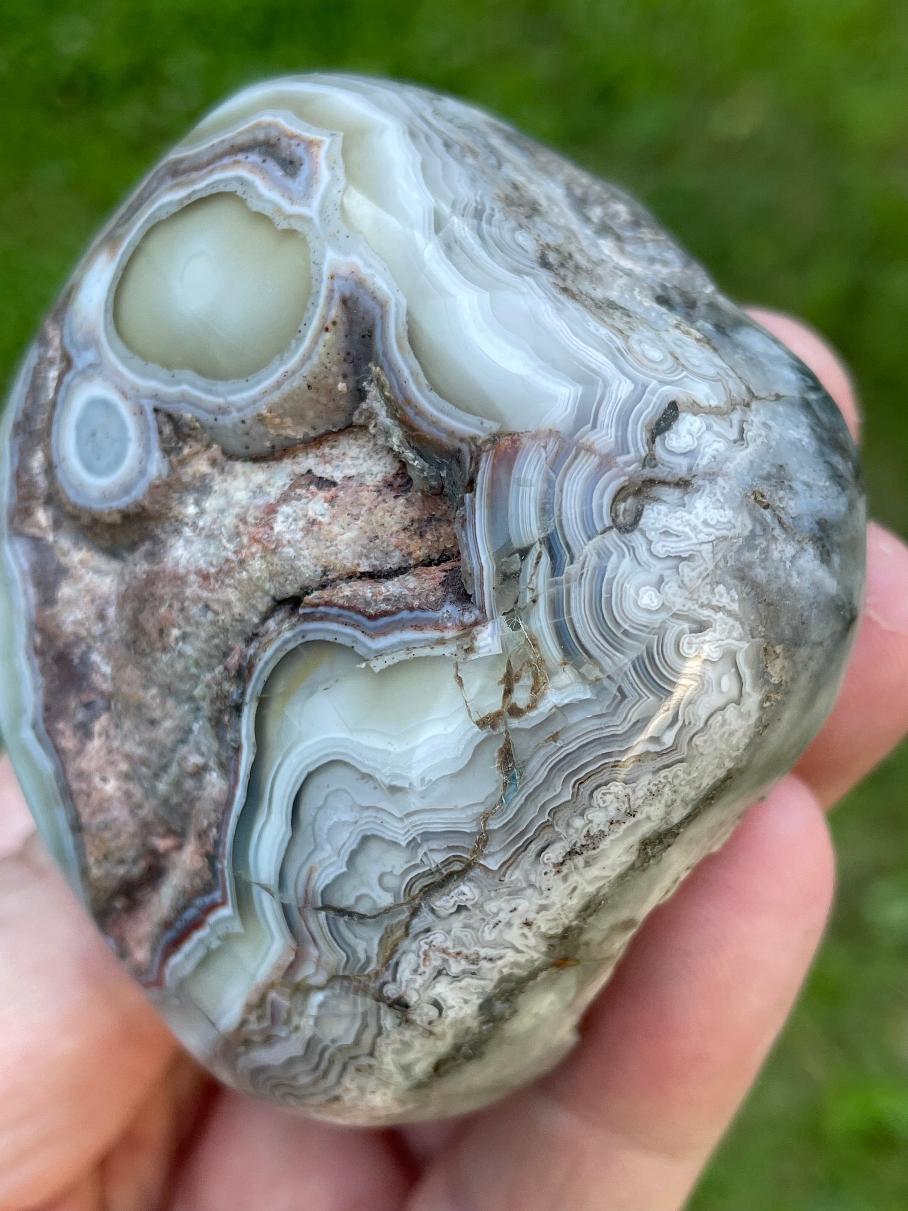 StoneBorn Creations Hand-Polished Lace Agate Freeform with Intricate Fortification Banding, Orbicular Eyes, Natural Matrix & Curved Display Face