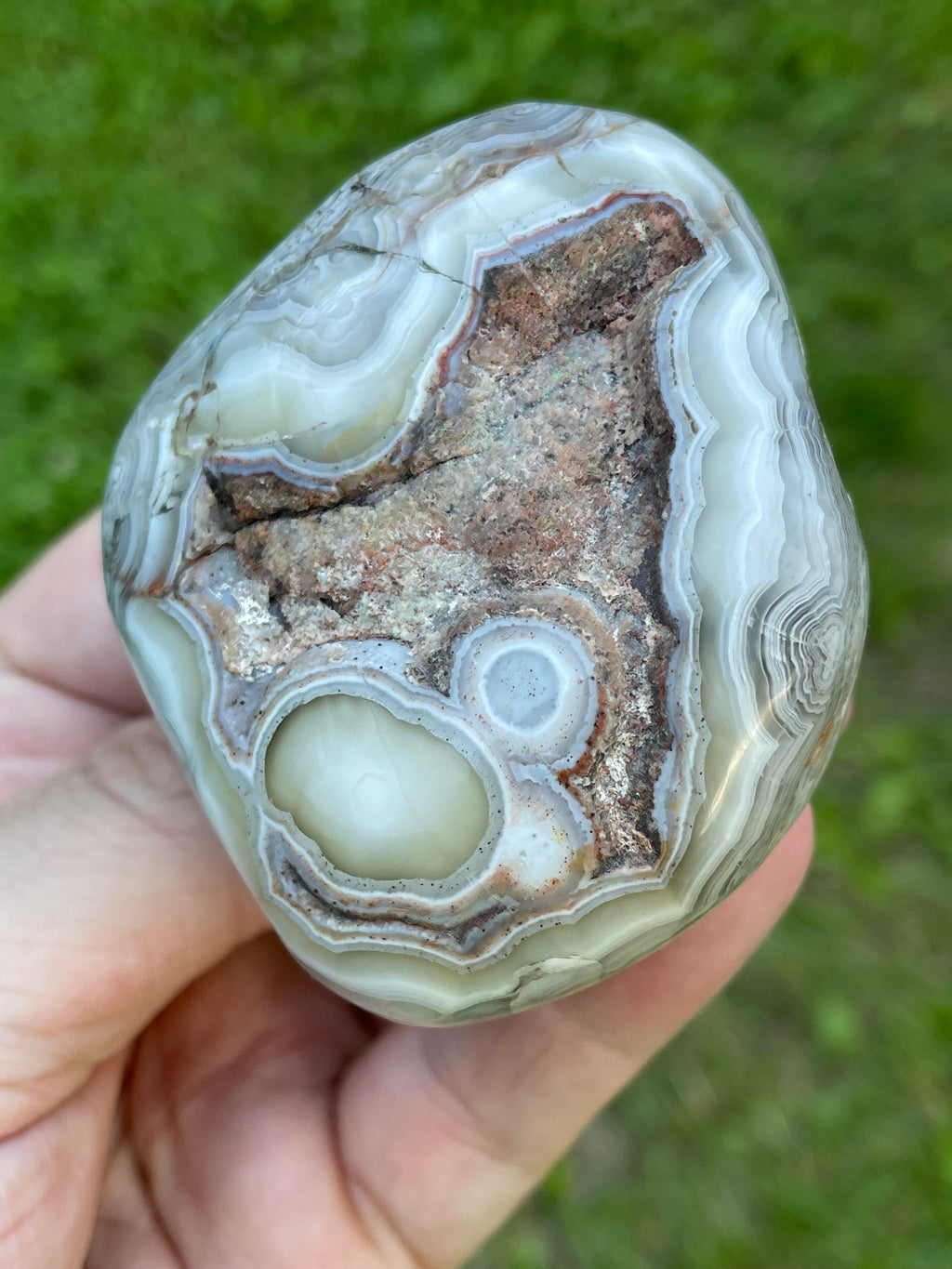 StoneBorn Creations Hand-Polished Lace Agate Freeform with Intricate Fortification Banding, Orbicular Eyes, Natural Matrix & Curved Display Face